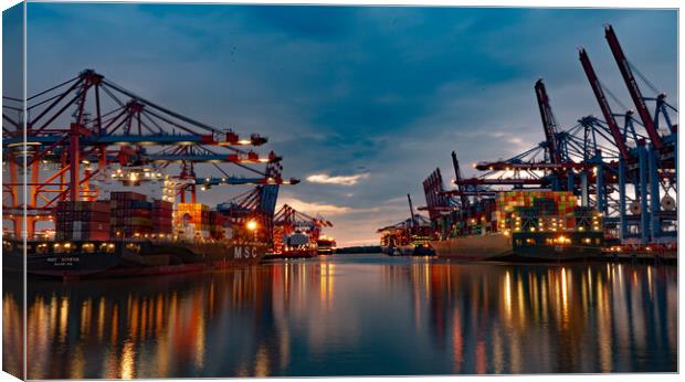 Huge loading cranes in the port of Hamburg by night - CITY OF HAMBURG, GERMANY - MAY 10, 2021 Canvas Print by Erik Lattwein