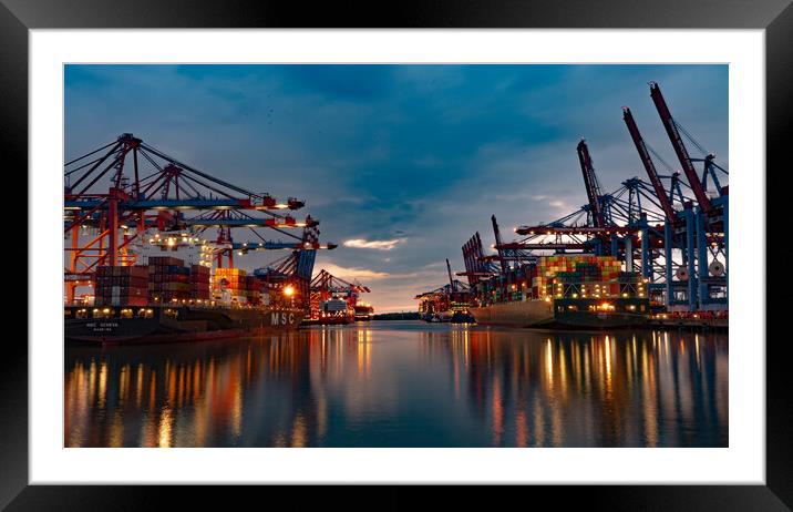 Huge loading cranes in the port of Hamburg by night - CITY OF HAMBURG, GERMANY - MAY 10, 2021 Framed Mounted Print by Erik Lattwein
