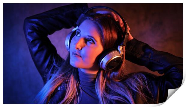 Young pretty woman listens to music - strong colorful close-up shot Print by Erik Lattwein