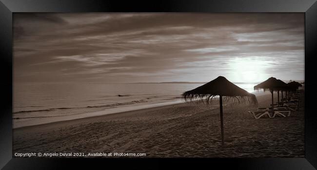 Sunset and umbrellas in Garrao - Algarve Framed Print by Angelo DeVal
