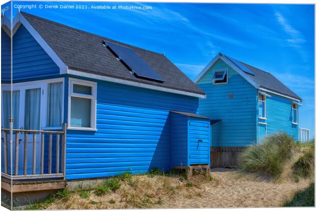 Blue Beach Huts Canvas Print by Derek Daniel
