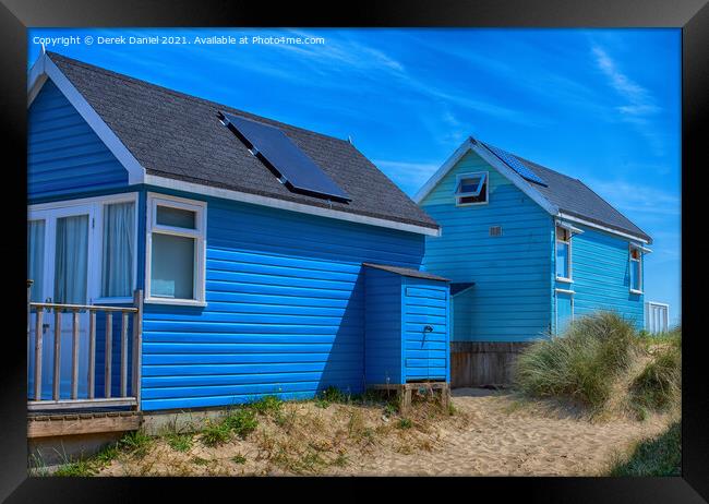 Blue Beach Huts Framed Print by Derek Daniel