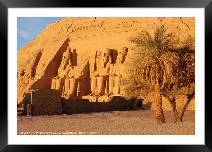 The Fantastic Statues of Abu Simbel from Right Through Trees, Egypt Framed Mounted Print by Philip Brown