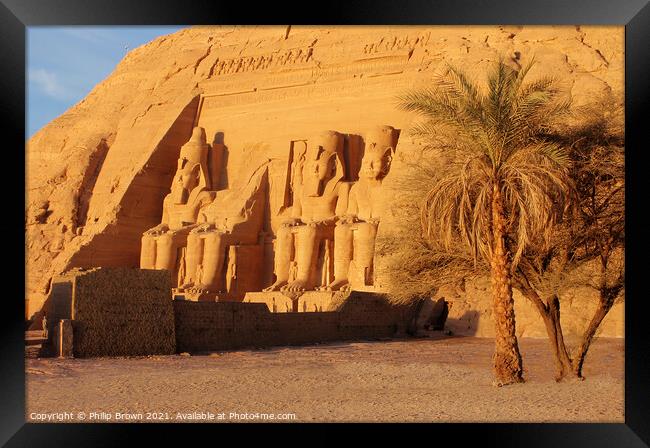 The Fantastic Statues of Abu Simbel from Right Through Trees, Egypt Framed Print by Philip Brown