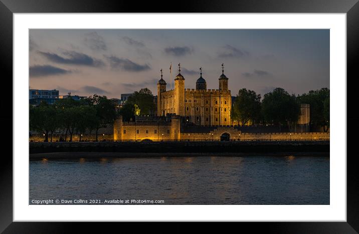 Tower of London Illuminated at dusk from the south bank walkway by Tower Bridge Framed Mounted Print by Dave Collins