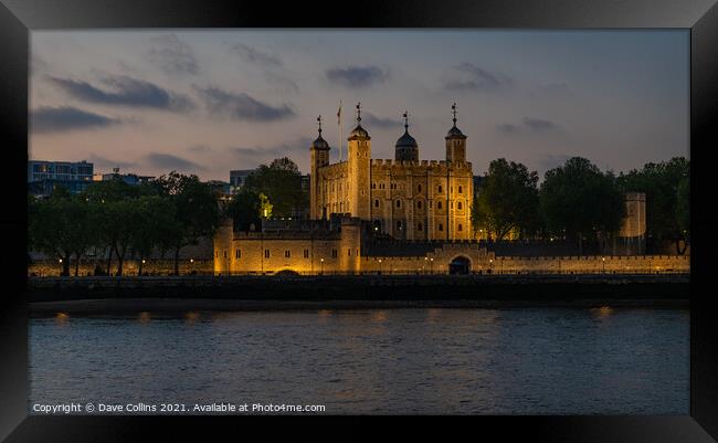 Tower of London Illuminated at dusk from the south bank walkway by Tower Bridge Framed Print by Dave Collins