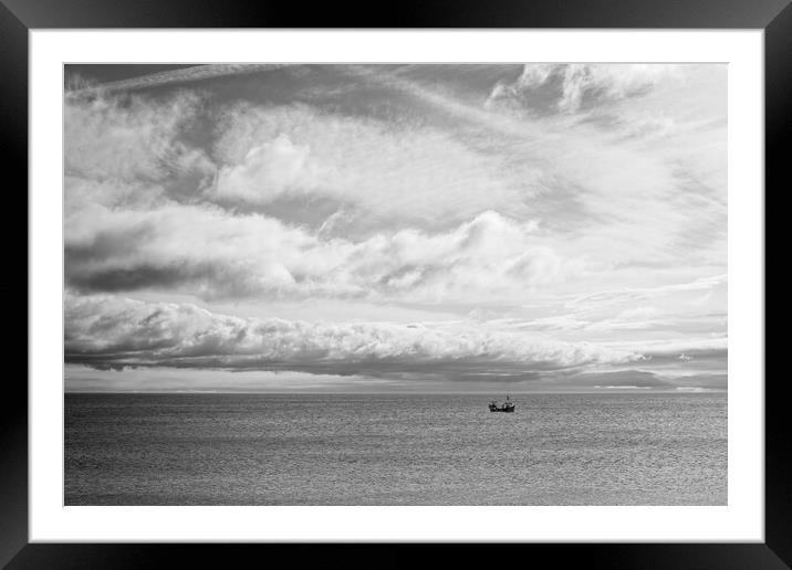 Lone Boat Under Cloudy Sky Framed Mounted Print by Rob Cole