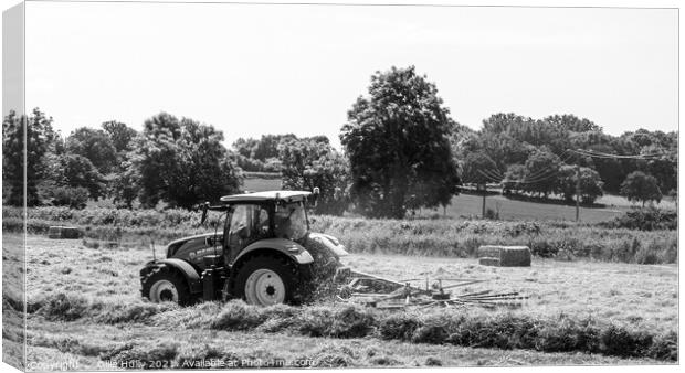 Tractor lining up the hey ready to bale in black and white Canvas Print by Ollie Hully