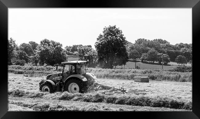 Tractor lining up the hey ready to bale in black and white Framed Print by Ollie Hully