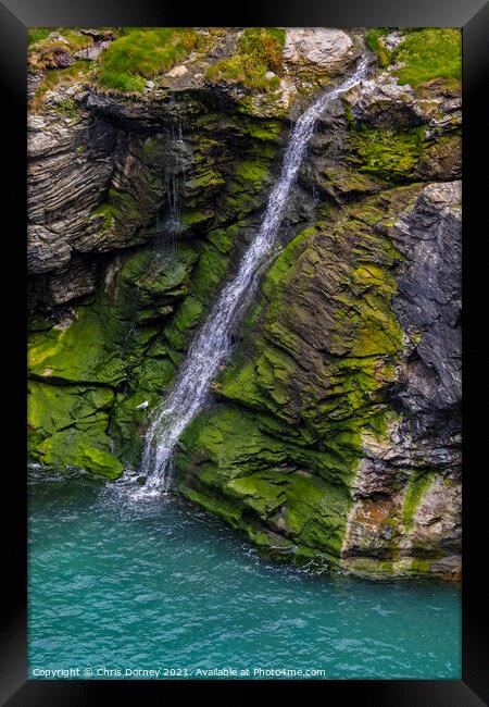 Waterfall at Tintagel Castle in Cornwall, UK Framed Print by Chris Dorney