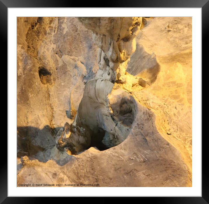 A gnome below a stalactite Framed Mounted Print by Hanif Setiawan