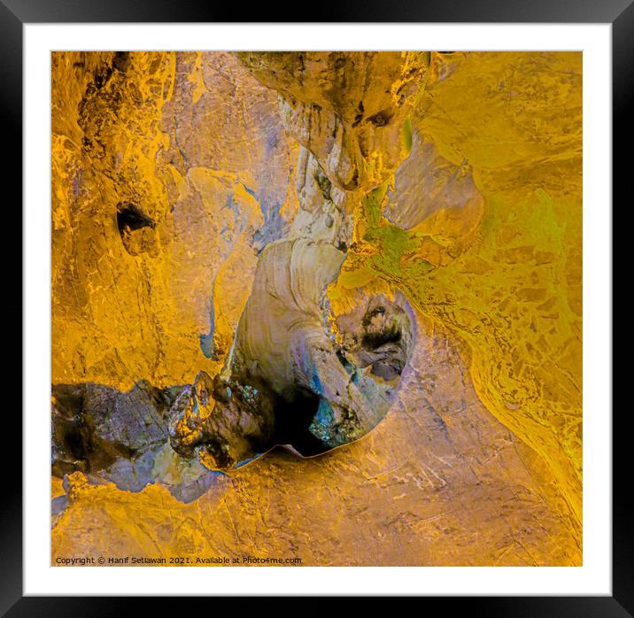 A gnome below a stalactite Framed Mounted Print by Hanif Setiawan