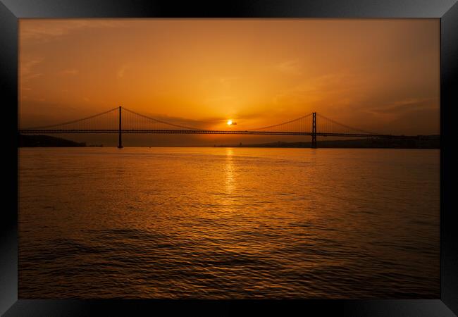 5th of April Bridge on Tagus River at Sunset Framed Print by Artur Bogacki