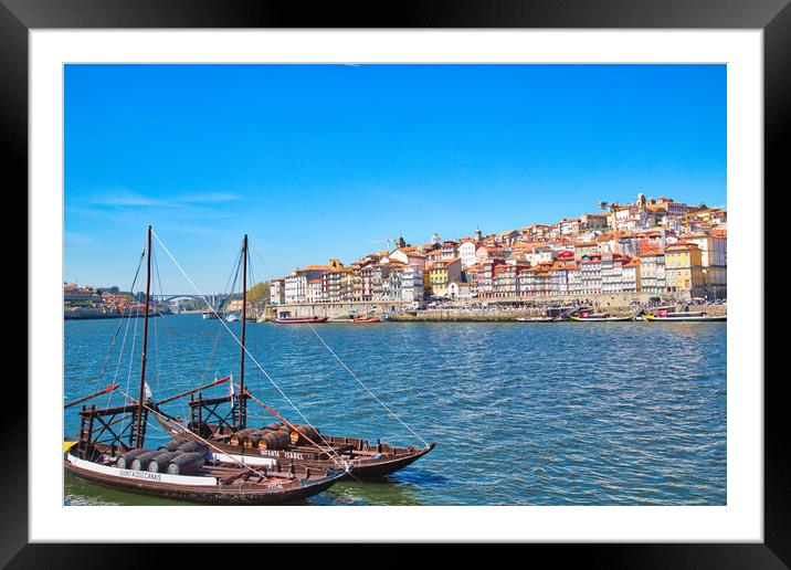 Famous colorful boats providing tours along banks of Rio Douro Framed Mounted Print by Elijah Lovkoff