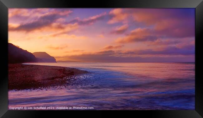 Serene Sunrise at Charmouth Beach Framed Print by Les Schofield