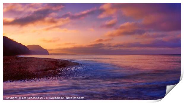 Serene Sunrise at Charmouth Beach Print by Les Schofield