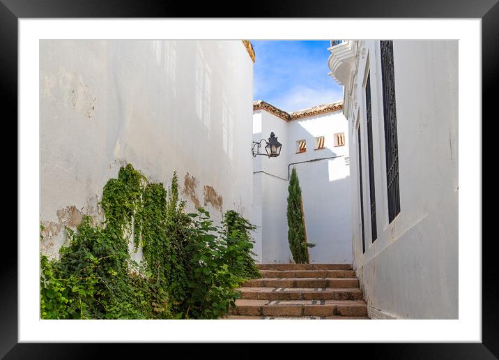 Cordoba streets on a sunny day in historic city center near Mezquita Cathedral Framed Mounted Print by Elijah Lovkoff