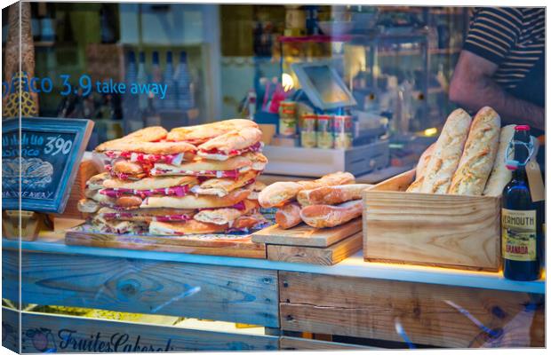 Famous Spanish jamon sandwich sold at the streets of Granada historic city center Canvas Print by Elijah Lovkoff