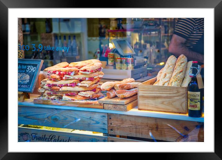 Famous Spanish jamon sandwich sold at the streets of Granada historic city center Framed Mounted Print by Elijah Lovkoff