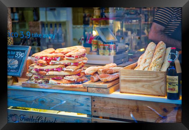 Famous Spanish jamon sandwich sold at the streets of Granada historic city center Framed Print by Elijah Lovkoff