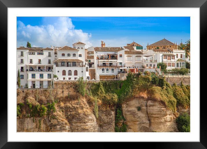 Famous Ronda restaurants and colonial houses overlooking the scenic gorge and the Puente Nuevo bridge Framed Mounted Print by Elijah Lovkoff