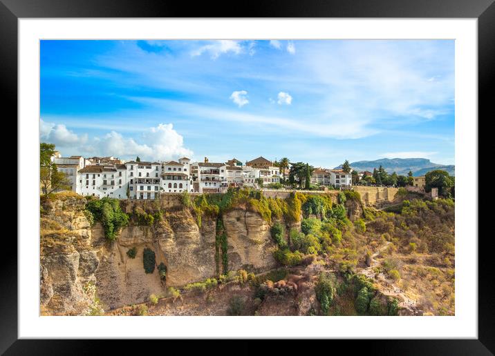 Famous Ronda restaurants and colonial houses overlooking the scenic gorge and the Puente Nuevo bridge Framed Mounted Print by Elijah Lovkoff