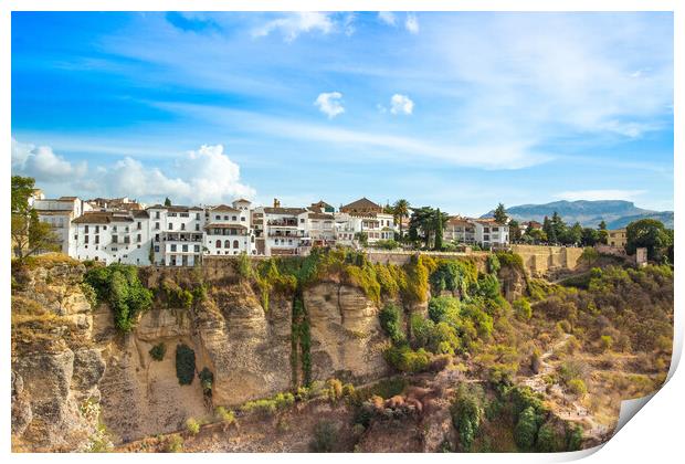 Famous Ronda restaurants and colonial houses overlooking the scenic gorge and the Puente Nuevo bridge Print by Elijah Lovkoff