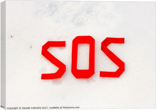 the word sos on a snowfield Canvas Print by daniele mattioda