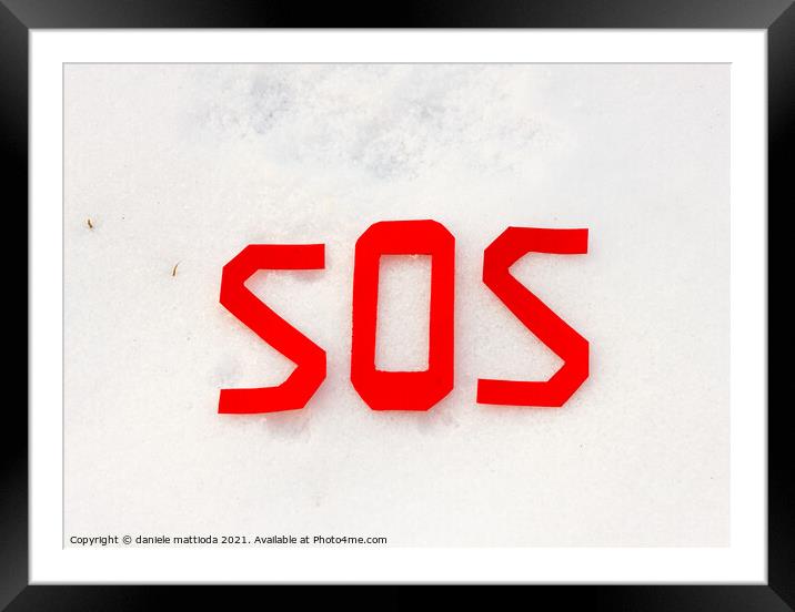 the word sos on a snowfield Framed Mounted Print by daniele mattioda