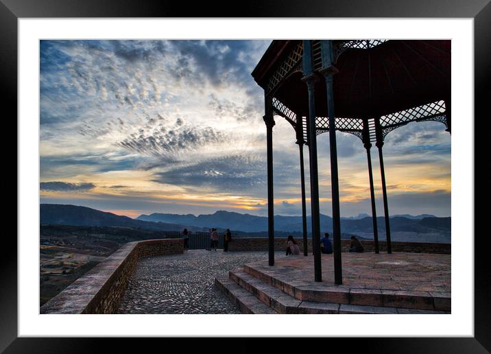 Tourists enjoying view from a scenic lookout at sunset in Ronda Framed Mounted Print by Elijah Lovkoff