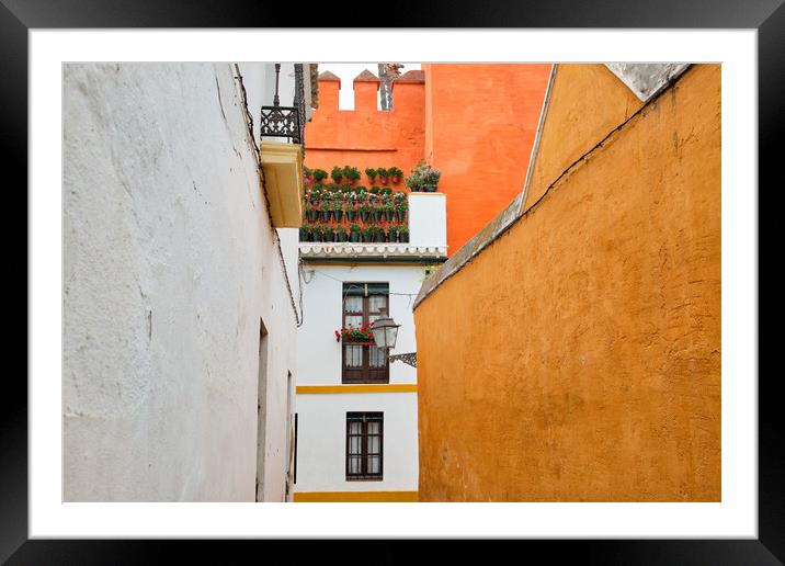 Seville streets at an early sunset in the scenic historic city center Framed Mounted Print by Elijah Lovkoff