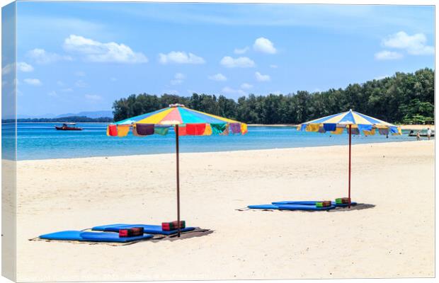 Umbrellas and beach mats on Nai Yang beach, Phuket, Thailand Canvas Print by Kevin Hellon