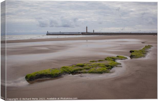 Tide out on Whitby Beach Canvas Print by Richard Perks
