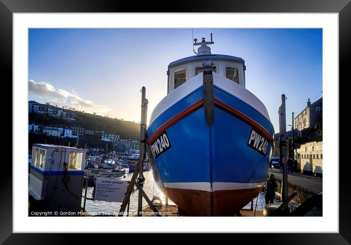 Fishing boat docked in Mevagissey Harbour, Cornwall, England. Framed Mounted Print by Gordon Maclaren