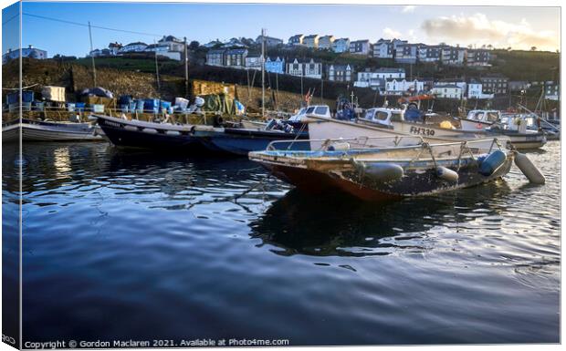 Boats moored in Mevagissey Harbour, Cornwall. Canvas Print by Gordon Maclaren