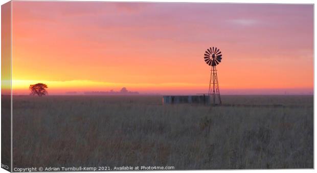 Sunrise over wind pump Canvas Print by Adrian Turnbull-Kemp
