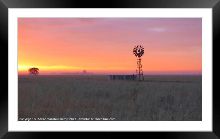 Sunrise over wind pump Framed Mounted Print by Adrian Turnbull-Kemp