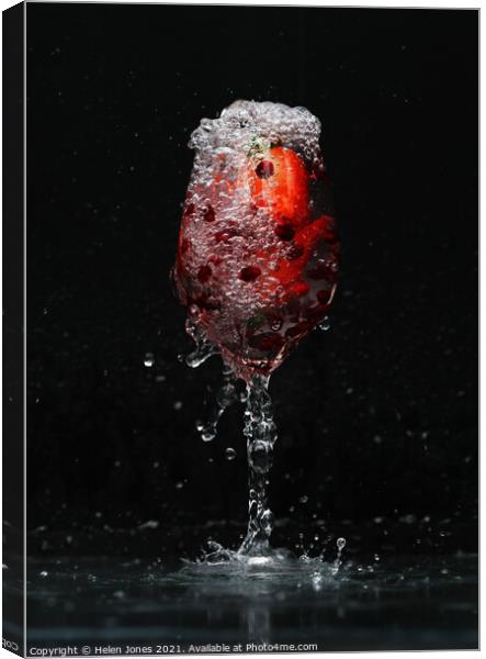 A glass of fizzy water and fruit Canvas Print by Helen Jones