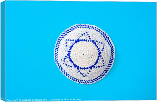 Kippah is a circular hat, with the flag of Israel, isolated on a Canvas Print by Joaquin Corbalan