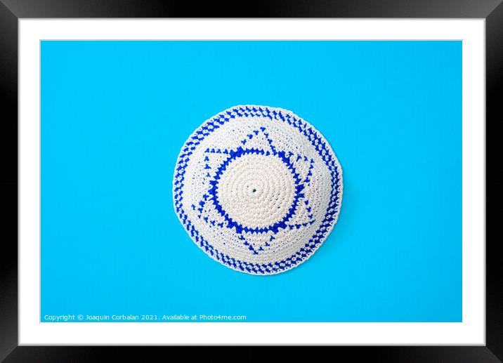 Kippah is a circular hat, with the flag of Israel, isolated on a Framed Mounted Print by Joaquin Corbalan