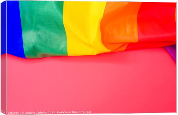 Red background with space for text, with the rainbow flag of the Canvas Print by Joaquin Corbalan