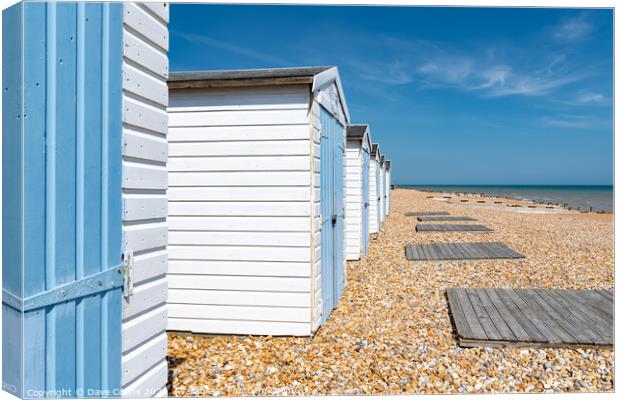 Beach Huts and the Coast at Bexhill in East Sussex Canvas Print by Dave Collins