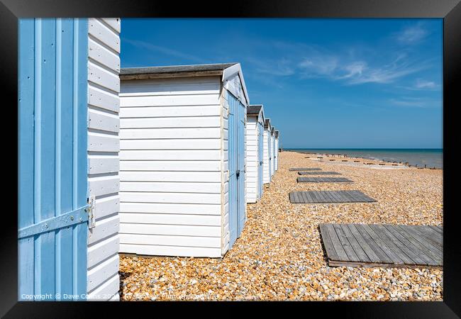 Beach Huts and the Coast at Bexhill in East Sussex Framed Print by Dave Collins