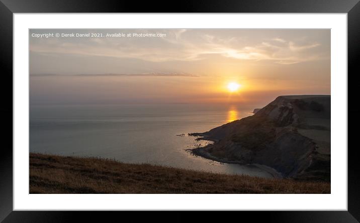 Jurassic coastline nearing Sunset Framed Mounted Print by Derek Daniel