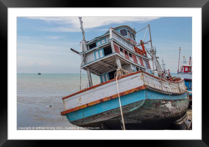 an old fishing boat in Thailand Framed Mounted Print by Wilfried Strang
