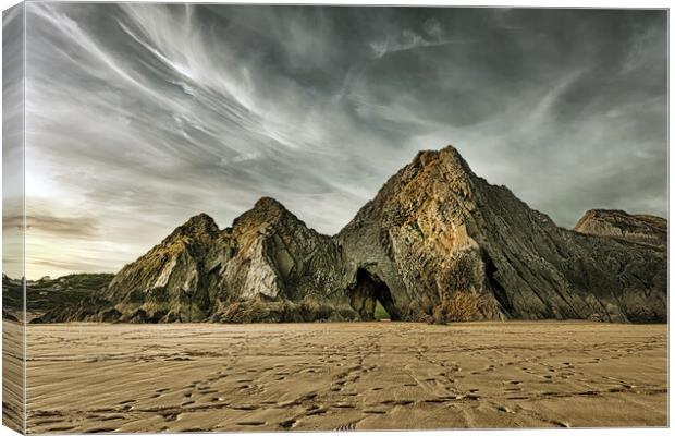 Jagged and dramatic Three Cliffs Bay Canvas Print by Leighton Collins