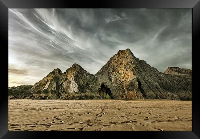 Jagged and dramatic Three Cliffs Bay Framed Print by Leighton Collins