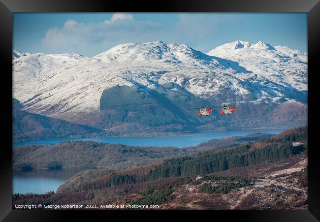 Two Sea Kings flying low over Loch Lomond Framed Print by George Robertson