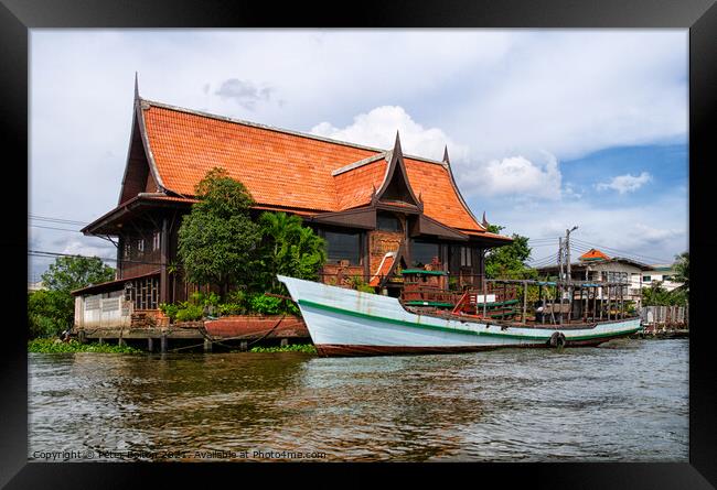 A large house on the banks of Chao Phraya, Bangkok, Thailand. Framed Print by Peter Bolton