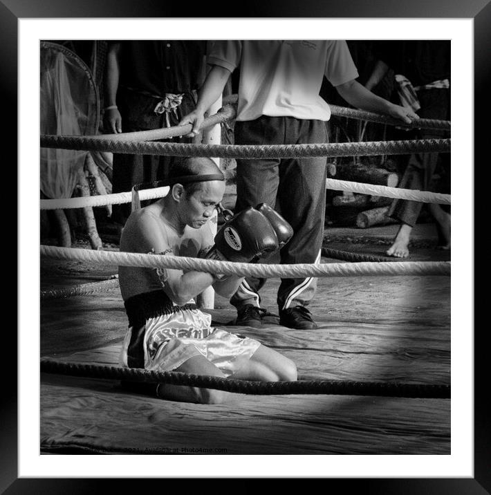 Muay Thai  boxer meditates before a bout. Bangkok, Thailand. Framed Mounted Print by Peter Bolton